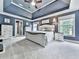 Spacious main bedroom with tray ceiling, large windows, and a comfortable king-size bed at 106 Twilight Overlook, Canton, GA 30114