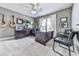 Bright home office featuring modern desk setup, stylish chairs, and decorative wall art at 106 Twilight Overlook, Canton, GA 30114