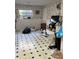 A kitchen featuring patterned tile flooring and lots of natural light from the window at 3838 Dunbury Ln, Decatur, GA 30032