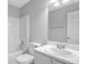Bright bathroom featuring a bathtub, toilet, vanity with sink, and modern fixtures at 6541 Lazy Creek Ct, Lithonia, GA 30058