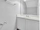 Clean bathroom with a white vanity, large mirror, and sleek fixtures at 6541 Lazy Creek Ct, Lithonia, GA 30058