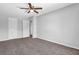 Bedroom with neutral carpet, fresh paint, ceiling fan and closet at 6541 Lazy Creek Ct, Lithonia, GA 30058