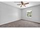 Cozy bedroom with natural light from the window and a ceiling fan at 6541 Lazy Creek Ct, Lithonia, GA 30058