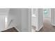 Hallway near stairs with tile flooring in bathroom and carpet floors in bedroom at 6541 Lazy Creek Ct, Lithonia, GA 30058