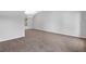 Large living room with neutral carpet, gray walls, a window with outside views, and natural lighting at 6541 Lazy Creek Ct, Lithonia, GA 30058