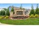 Stone community sign with beautiful landscaping and trees at 99 Silver Leaf Trce, Douglasville, GA 30134