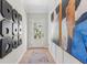 Bright hallway featuring modern decor and a glass-paneled front door, leading to natural light at 99 Silver Leaf Trce, Douglasville, GA 30134