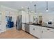 Bright, open kitchen with stainless steel appliances, granite counters and hardwood floors adjoining the dining and living areas at 99 Silver Leaf Trce, Douglasville, GA 30134
