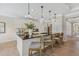 Bright kitchen island with white cabinets, a dark countertop, and bar stool seating at 99 Silver Leaf Trce, Douglasville, GA 30134
