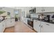 Contemporary kitchen showcasing white cabinetry, stainless steel appliances, and stylish countertops for a sleek design at 99 Silver Leaf Trce, Douglasville, GA 30134