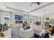 Inviting living space featuring TV over a fireplace, leading to the dining area and backyard access at 99 Silver Leaf Trce, Douglasville, GA 30134