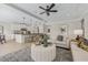 Open-concept living room seamlessly connects to a kitchen with island seating and modern fixtures at 99 Silver Leaf Trce, Douglasville, GA 30134