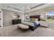 Spacious main bedroom featuring a tray ceiling, accent lamps, decor, and plush carpeting at 99 Silver Leaf Trce, Douglasville, GA 30134