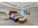 Bright main bedroom featuring an accent ceiling, pendant lighting, and large windows at 99 Silver Leaf Trce, Douglasville, GA 30134
