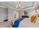 Bright main bedroom boasts a tray ceiling, a decorative mirror, and an en suite bathroom at 99 Silver Leaf Trce, Douglasville, GA 30134