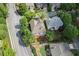 Aerial view of house with gray roof and wooded, landscaped neighborhood at 2250 Norbury Se Dr, Smyrna, GA 30080
