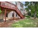 View of the backyard featuring a two-story deck with brick patio at 2250 Norbury Se Dr, Smyrna, GA 30080