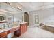Large bathroom with a chandelier, soaking tub and walk-in shower at 2250 Norbury Se Dr, Smyrna, GA 30080