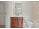 Bathroom with a vanity and tiled bathtub/shower combination at 2250 Norbury Se Dr, Smyrna, GA 30080