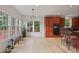 Breakfast nook with hardwood floors, oversized windows, and custom lighting at 2250 Norbury Se Dr, Smyrna, GA 30080