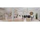 Open dining area with wood floors, modern chandelier, and view of the staircase at 2250 Norbury Se Dr, Smyrna, GA 30080