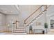 Spacious foyer with wood floors and staircase leading to the second level at 2250 Norbury Se Dr, Smyrna, GA 30080