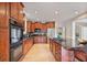 Bright kitchen with stainless steel appliances, cherry wood cabinets, and granite countertops at 2250 Norbury Se Dr, Smyrna, GA 30080