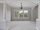 Large living room featuring decorative columns, large windows and neutral paint at 2250 Norbury Se Dr, Smyrna, GA 30080