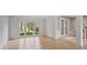 Bright living room with wood floors, large windows, and view of the front yard at 2250 Norbury Se Dr, Smyrna, GA 30080