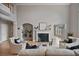 Spacious living room with fireplace, wood floors, and high ceilings at 2250 Norbury Se Dr, Smyrna, GA 30080