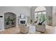 Bright living room with fireplace, hardwood floors, and high ceilings at 2250 Norbury Se Dr, Smyrna, GA 30080