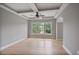 Spacious living room with trey ceilings, hardwood floors, and bright natural light at 2250 Norbury Se Dr, Smyrna, GA 30080
