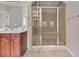 Modern bathroom featuring a tiled shower with a glass door and double shower heads at 2250 Norbury Se Dr, Smyrna, GA 30080