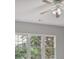 The bedroom boasts three large windows that flood the space with natural light and offer views of the lush outdoors at 2250 Norbury Se Dr, Smyrna, GA 30080