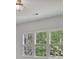 A bank of windows allows plenty of natural light into the room, with views of mature trees at 2250 Norbury Se Dr, Smyrna, GA 30080