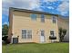 The backyard has vinyl siding and a well-manicured lawn at 2428 Black Forest Dr, Conyers, GA 30012