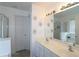 Bright bathroom with double sinks, large mirror, and a shower/bath at 2428 Black Forest Dr, Conyers, GA 30012