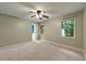 Large bedroom with ceiling fan, carpet, natural light and en-suite bathroom access at 299 Fieldview Dr, Auburn, GA 30011