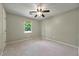 Neutral bedroom with carpet, ceiling fan, window and closet at 299 Fieldview Dr, Auburn, GA 30011
