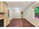 Bright breakfast nook features wood floors, a window with views and kitchen access at 299 Fieldview Dr, Auburn, GA 30011