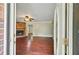 Warm and inviting living room with beautiful hardwood floors and a cozy brick fireplace at 299 Fieldview Dr, Auburn, GA 30011