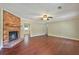 Bright and spacious living room with hardwood floors and a fireplace, creating a welcoming and comfortable atmosphere at 299 Fieldview Dr, Auburn, GA 30011