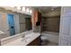 Bathroom showing double vanity and a bathtub with decorative tile surround at 3246 Able Ct, Marietta, GA 30062