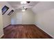 Spacious bedroom with skylights, hardwood flooring, vaulted ceiling, neutral walls and trim, and a doorway at 3246 Able Ct, Marietta, GA 30062