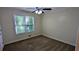 Neutral bedroom offering carpeted floors, a ceiling fan and a large window at 3246 Able Ct, Marietta, GA 30062