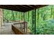 Second level deck with railings provides stunning views of the lush, private wooded backyard at 3246 Able Ct, Marietta, GA 30062