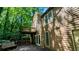 Exterior of home features a deck on multiple levels with stairs and a lush green backdrop at 3246 Able Ct, Marietta, GA 30062