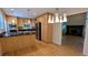 Bright eat-in kitchen features light wood cabinets, stainless steel appliances, hardwood flooring and access to the living room at 3246 Able Ct, Marietta, GA 30062