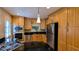 This eat-in kitchen features light wood cabinetry, stainless steel appliances, black countertops and recessed lighting at 3246 Able Ct, Marietta, GA 30062