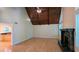 Bright living room with a fireplace, hardwood floors, wooden ceiling, and large windows for natural light at 3246 Able Ct, Marietta, GA 30062